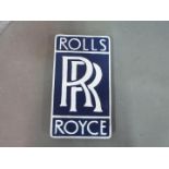 A cast iron wall plaque advertising Rolls Royce