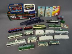 A lot to include various, diecast models of trams and coaches by Corgi,