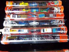 Matchbox Mattel Wheels - seven sealed tubes containing five model motor vehicles,