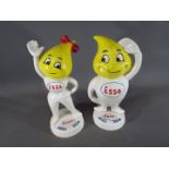 A pair of cast iron Esso money banks,