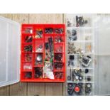 Three plastic compartmentalised cases each containing a good selection of model parts, wheels, nuts,