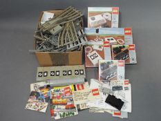 Lego - A quantity of boxed and unboxed vintage Lego Railway System parts and ephemera.