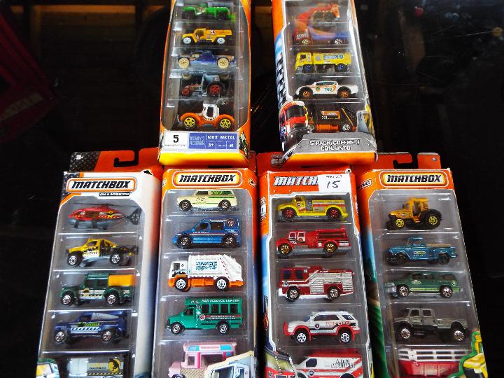 Matchbox on a Mission, Mattel six sealed packs each containing five model motor vehicles,