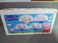 A child's bicycle 'Peppa Pig' by Dino Bikes, Italy, suitable for ages 3-4, in factory sealed box.