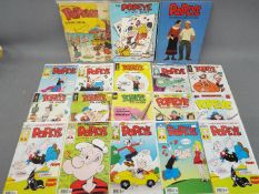 A collection of vintage Popeye comics, activity book and movie storybook.