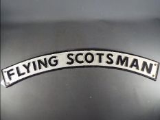 A cast iron black and white Flying Scotsman railway sign,