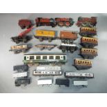 Hornby, Mecanno, MLL - A small collection of unboxed O gauge tinplate rolling stock and locomotives.