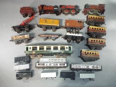 Hornby, Mecanno, MLL - A small collection of unboxed O gauge tinplate rolling stock and locomotives.