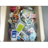 A collection of over 60 vintage and retro packs of playing cards and games.