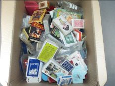 A collection of over 60 vintage and retro packs of playing cards and games.