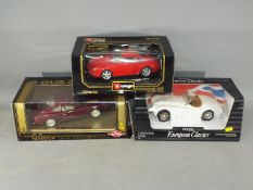 Bburago, Guilloy, Ertl - Three boxed diecast model cars in 1:18 scale.