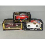 Bburago, Guilloy, Ertl - Three boxed diecast model cars in 1:18 scale.