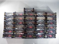 Onyx - 31 boxed diecast F1 and Car racing cars by Onyx.