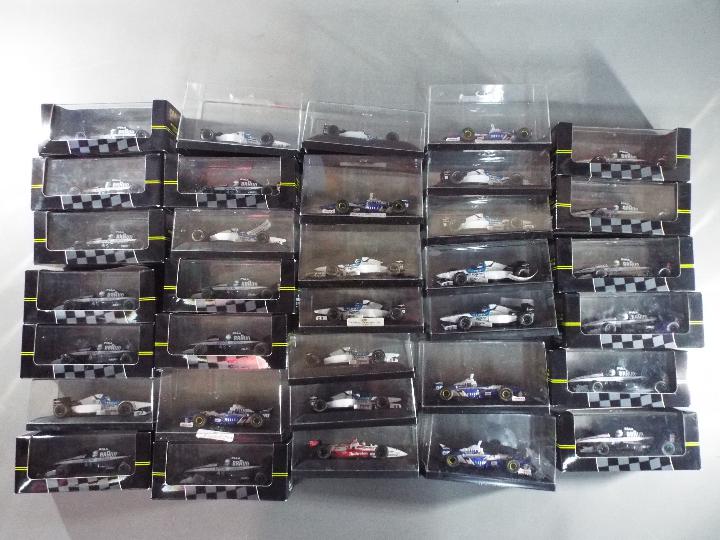 Onyx - 34 boxed diecast F1 racing cars by Onyx.