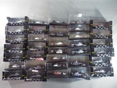Onyx - 34 boxed diecast F1 racing cars by Onyx.