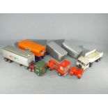 A small collection of Japanese and possible European tinplate commercial vehicles and trailers Lot