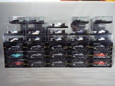 Onyx - 30 diecast model cars by Onyx from the F1 collection, models are contained in display boxes,