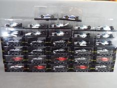 Onyx - 32 diecast models by Onyx from the F1 and Indy Car collections,