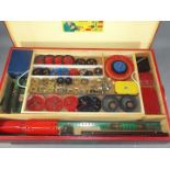 Meccano - A vintage Meccano set 7A presented in a red wooden box on castors with a lift off lid and