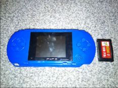 Gaming - a PXP 3 hand-held games console with a games compendium disk