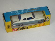 Corgi - a diecast model Rolls Royce Silver Shadow finished in pearlescent white over grey with blue
