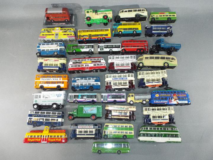 Corgi - In excess of 30 Corgi diecast model buses, trams and commercial vehicles in various scales.