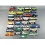 Corgi - In excess of 30 Corgi diecast model buses, trams and commercial vehicles in various scales.