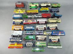 Corgi - In excess of 30 Corgi diecast model buses, trams and commercial vehicles in various scales.