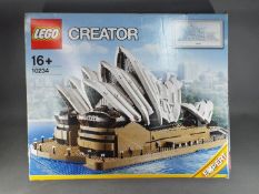 Lego - A boxed Lego Creator 10234 Sydney Opera House with broken seals.