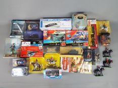 A good mixed collection of boxed and unboxed diecast vehicles, metal and plastic figures,