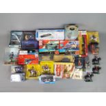 A good mixed collection of boxed and unboxed diecast vehicles, metal and plastic figures,