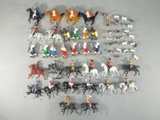 Britains and others - Approximately 14 repainted Pre War Mounted Britains figures with a group of