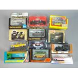 Corgi, EFE, Dinky and others - 12 boxed diecast model vehicles in various scales.