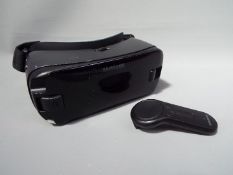 A Samsung Gear VR headset and controller.