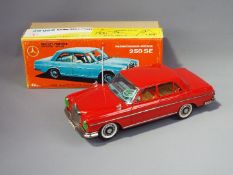 Ichiko (Japan) - A boxed Ichiko 'Mystery Action' tinplate battery operated Mercedes Benz 250SE .