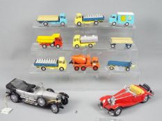 Corgi, Matchbox, Franklin Mint - A small collection of 11 unboxed diecast vehicles.