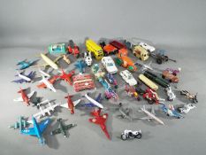 Dinky, Matchbox and Others - A collection of over 30 unboxed diecast and plastic model vehicles.