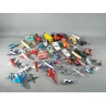 Dinky, Matchbox and Others - A collection of over 30 unboxed diecast and plastic model vehicles.