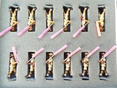 Asset Military and Civilian Figures - a set of twelve marching figures,