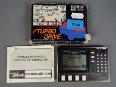 Casio - A boxed vintage Casio MG-200 Turbo Drive Calculator / Game.