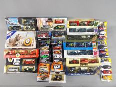 Lledo, Corgi, Matchbox, Cararama - Over 20 boxed diecast vehicles in various scales.