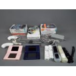 Nintedo - An unboxed Nintendo Wii games console, with accessories,