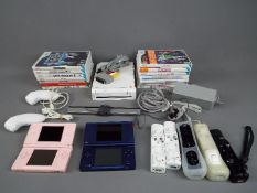 Nintedo - An unboxed Nintendo Wii games console, with accessories,