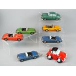 Six boxed resin display models depicting various motor vehicles and a boxed Classix money box.