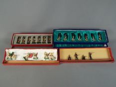 Britains, Unconfirmed Maker - Four sets of toy soldiers.