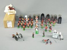 Britains - Approximately 40 unboxed military figures and accessories by Britains.