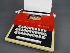 Petite International - A Petite International Deluxe toy typewriter in a hard carry case.