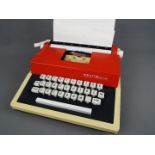 Petite International - A Petite International Deluxe toy typewriter in a hard carry case.