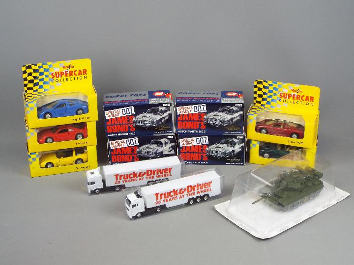 Corgi, Maisto and others - Seven boxed diecast vehicles in various scales.