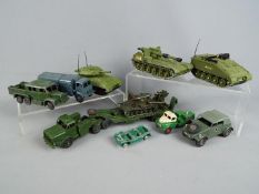 Dinky Toys - A small regiment of 11 unboxed military vehicles by Dinky Toys.